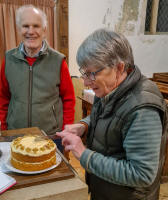 Mary Garner cuts Chris McArthur's birthday cake in front of the man himself. (taken by Mike Whitby).