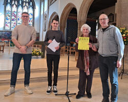 The judges and Diana Pipe present Julian Colman with the certificate for The Norman Tower band.