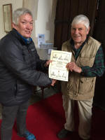 Robert Rolph receiving his 50 years membership Guild Certificate from Rowan Wilson.