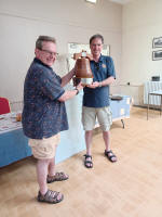 Jonathan Williamson presents the Pat Bailey Shield to Philip Gorrod of Halesworth.