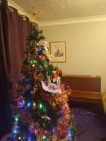 Our Christmas tree, with a George Pipe drawing of St Mary-le-Tower on the wall.