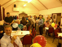 Guests gathered at Sproughton Village Hall for Dad's 70th birthday party.