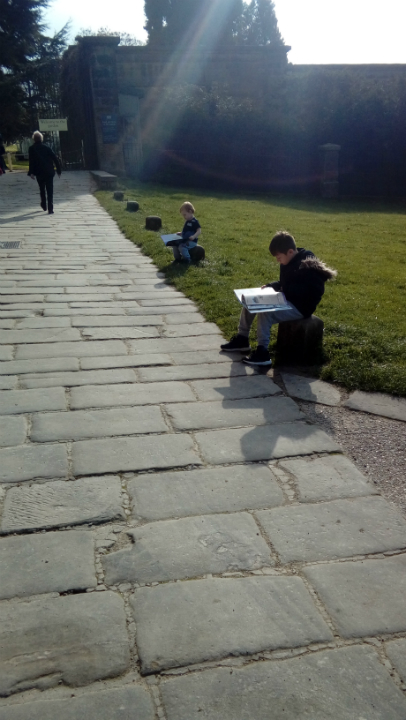 Alfie & Mason reading their new books outside Chatsworth House.