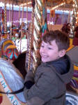 Mason on the merry-go-round at Bressingham.