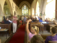 Voting for the next destination of next year's tour in the Tour Meeting in Hothfield church.