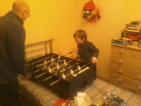 Unky Chris and Henry playing table football at Mason's party.