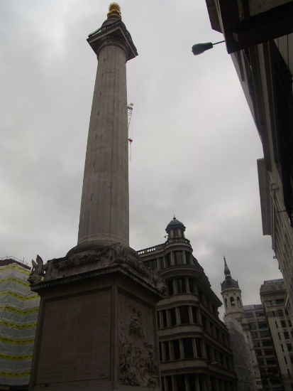 The Monument, with the tower of St Magnus.