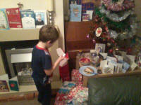 Mason reading Father Christmas' thank you note.