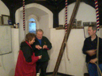 Sally & Alan Munnings and Mike Whitby await ringing in the service touch at Wickham Market.