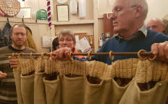 Chris McArthur & myself help Mary Garner put the curtain on its rail at Pettistree practice.