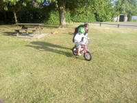 Alfie having his first practice at cycling without stabilisers.
