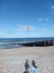 Flying a kite on Whitstable beach.