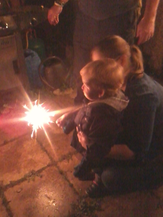 Alfie enjoying sparklers for the first time at his Granny's house, under close supervision from Mummy!