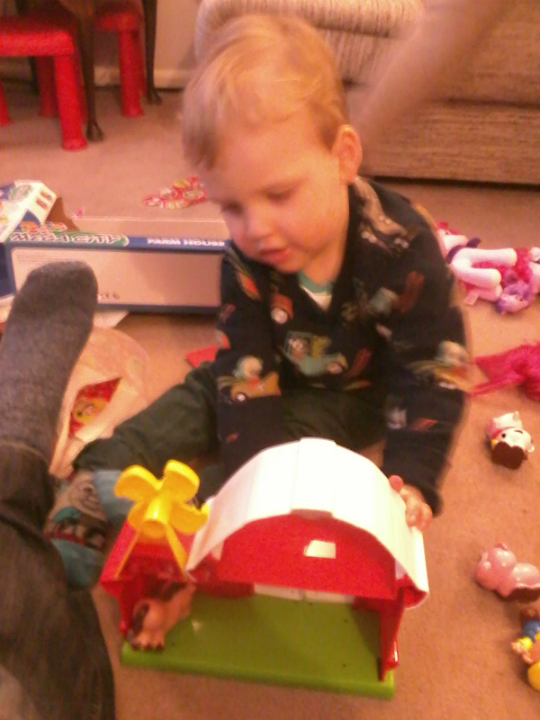  Alfie with one of his many new toys.