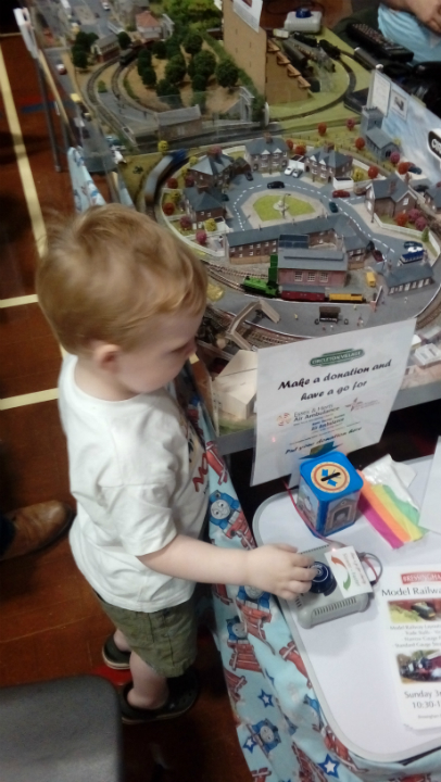 Alfie having fun with model trains at The Woodbridge Model Railway Exhibition.