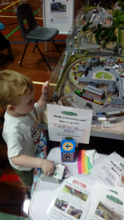 Alfie having fun with model trains at The Woodbridge Model Railway Exhibition.