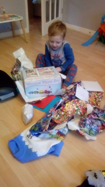 Alfie opening his presents.