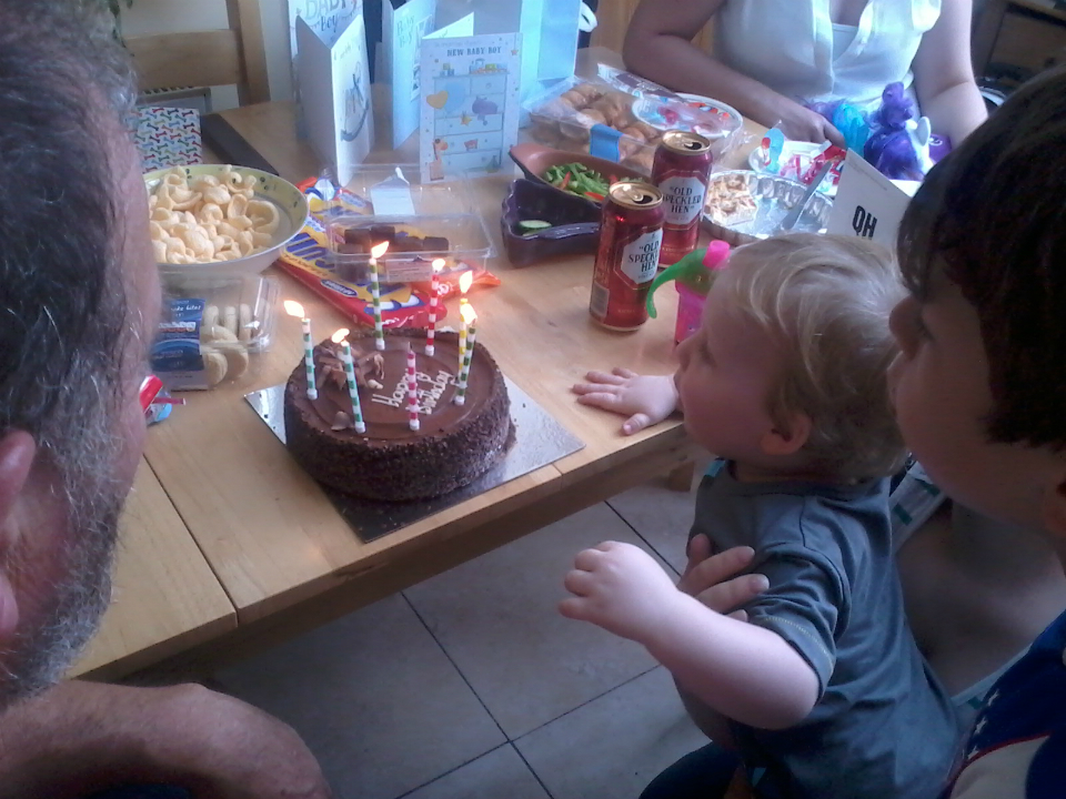 Alfie & Mason help Ruthie blow out the candles on her birthday cake.