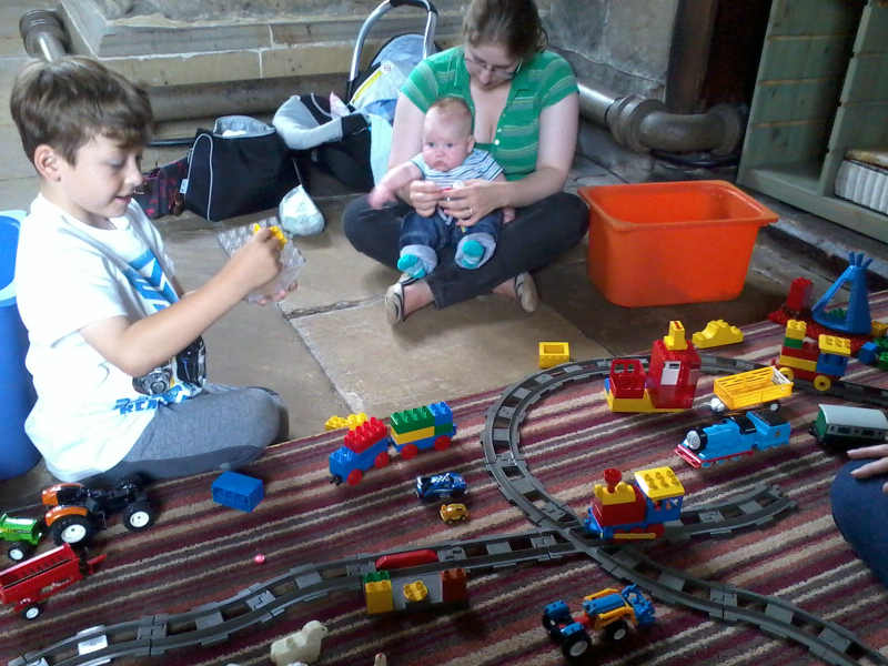 Alfie taking a deep interest in what his brother Mason is doing whilst Ruthie oversees.
