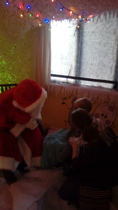 Alfie and Ruthie meet Father Christmas.