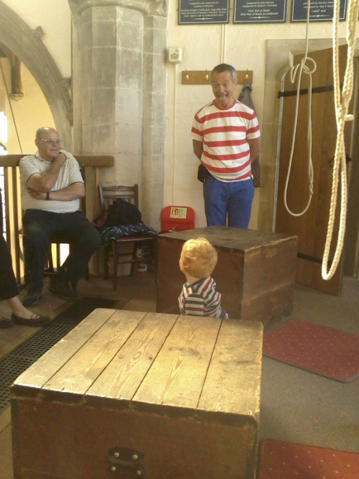 Richard Knight and Mike Whitby entertain Alfie between the seventh and tenor boxes at Clare on the Pettistree outing.