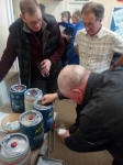  Jed Flatters pours beer whilst Chris McCarthy and Nigel Gale wait patiently.