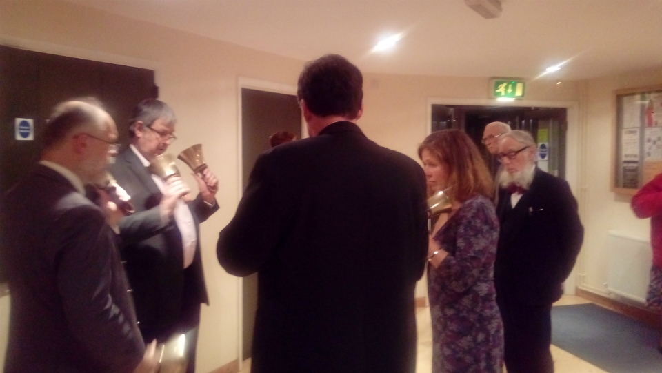 Handbell ringing in the foyer following formal proceedings at for the 95th Anniversary Suffolk Guild Dinner at The Blackbourne Community Centre in Elmswell.