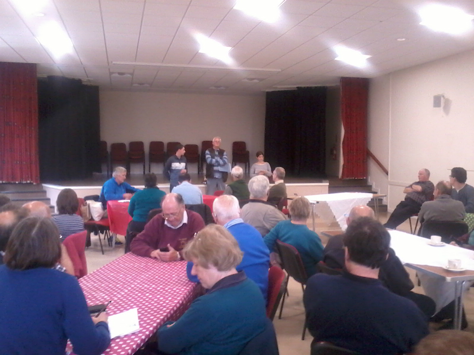 Listening to the results of the Six-Bell Competitions in the Community Centre in Horringer.