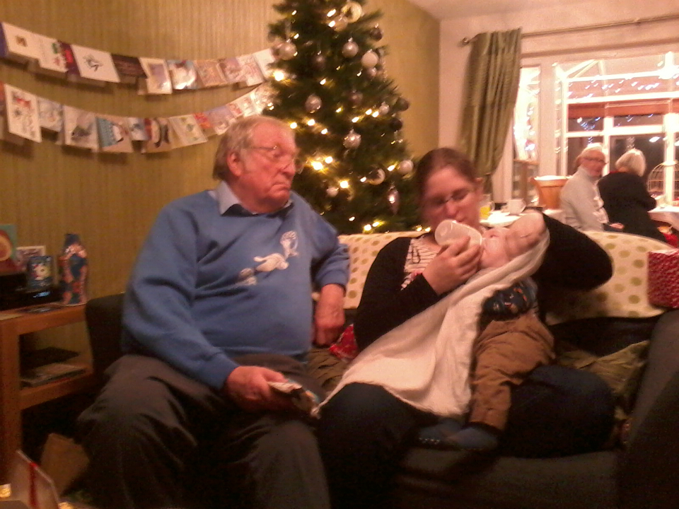 Joshua getting his drinking in at Chris and Becky's, under the close supervision of his mother and Granddad.