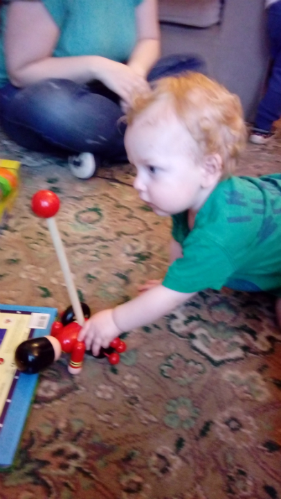 Joshua playing with one of his new toys at my Mum & Dad's on his first birthday.