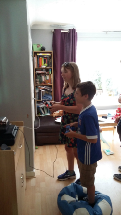 Laura Davies being entertained by Mason at our house.