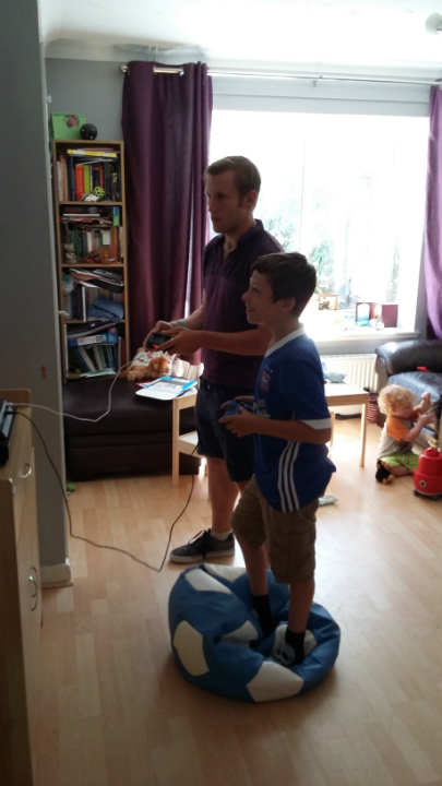 Louis Suggett being entertained by Mason at our house.