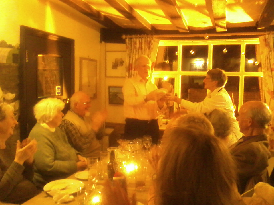 Mary Garner presents Chris McArthur with Mary's 'Monthly' Plate at the Pettistree Dinner.