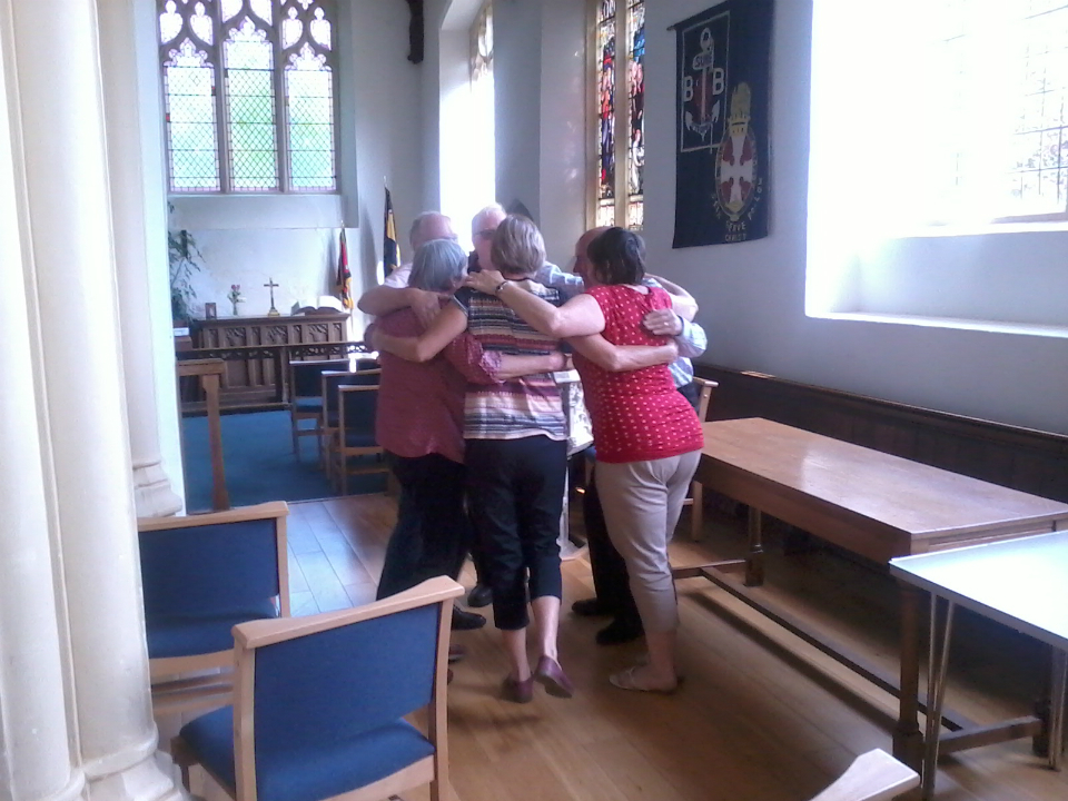 The Wickham Market team in a group hug before they go up to ring.