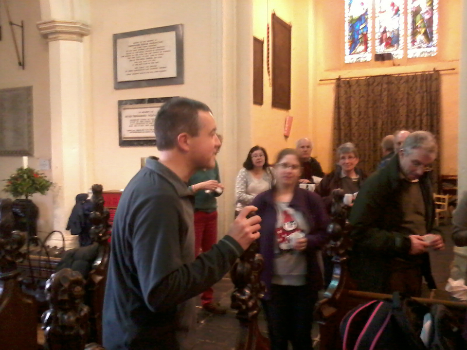 South-East District Chairman Ralph Earey speaks at the post-ring gathering in St Margaret's church.