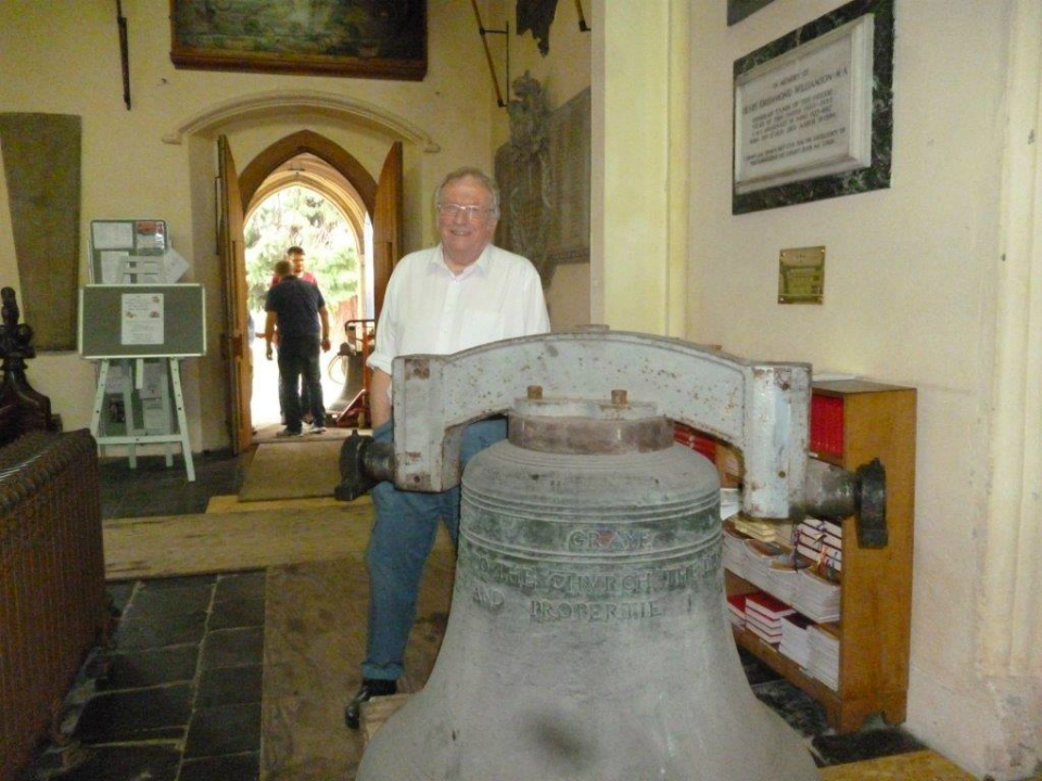 Dad with one of the bells of St Margaret's Ipswich on the church floor.