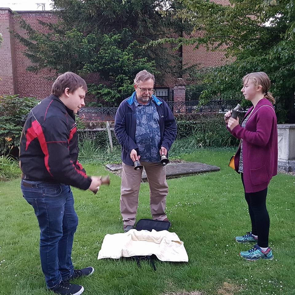 Ringing handbells in St Mary-le-Tower churchyard
