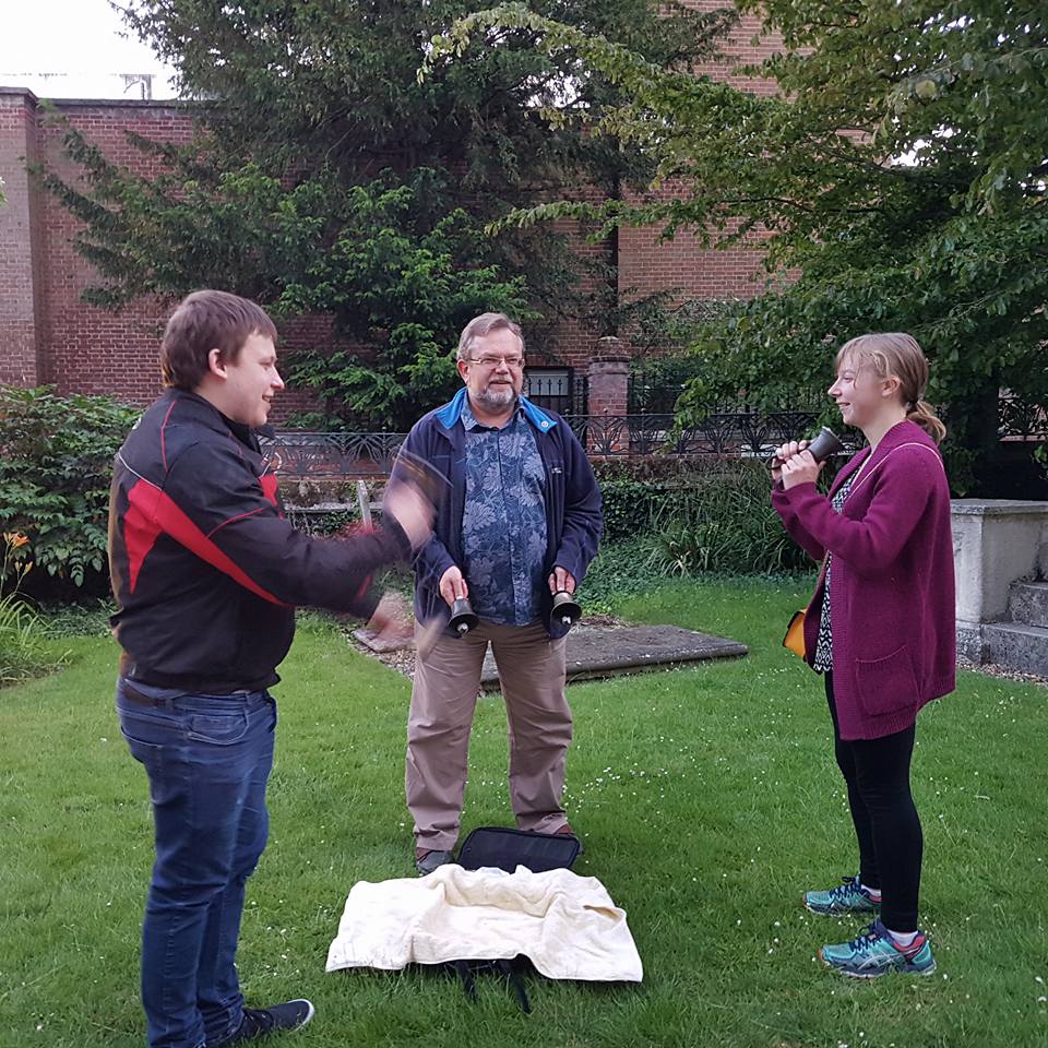 Ringing handbells in St Mary-le-Tower churchyard