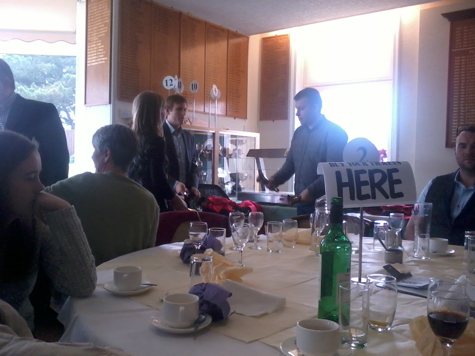 Handbell ringing at the St Mary-le-Tower Dinner. l to r - Laura Davies, Louis Suggett and George Vant.