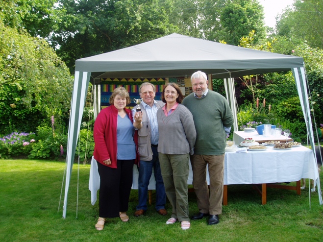 Picture of Some of the winning band from Hollesley Church receive their prize from Rev Harry Edwards 