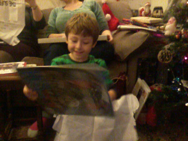 Mason opens his Thomas the Tank Engine 2014 calendar.