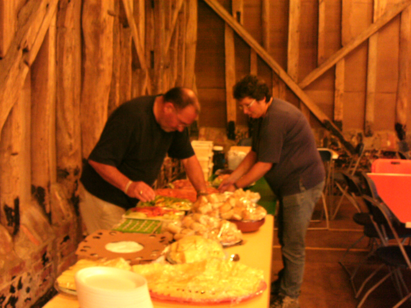 Ron and Kate putting out the food.