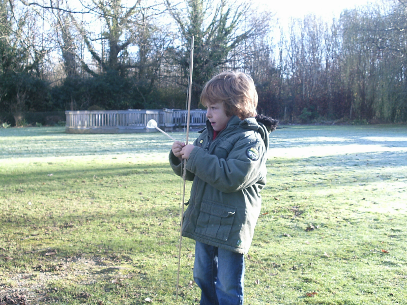 Mason trying out his bow and ‘arrows’.