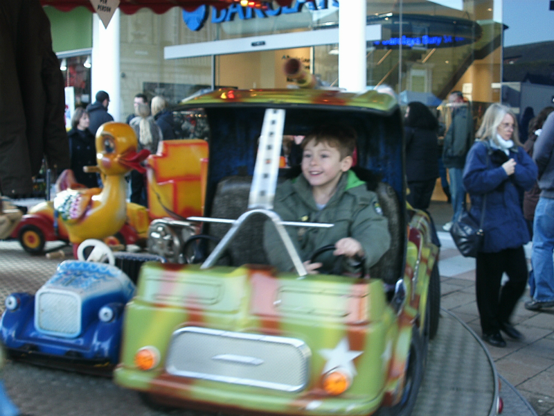 Mason on the merry-go-round.