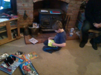 Mason ripping into cards and presents at his birthday party.