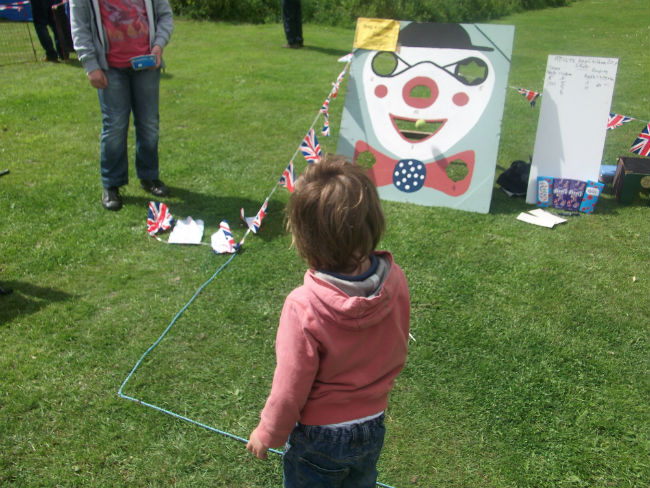 At Melton Recreation Ground trying to get a ball in the clown's mouth!