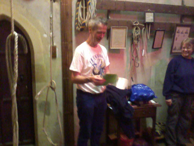 Mike opening his birthday card in Ufford ringing chamber.